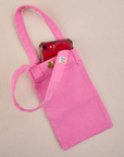 Phone tucked into bubblegum pink Cell Phone Tote