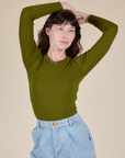 Long Sleeve Baby Tee in Summer Olive worn by Alex