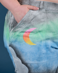 Close up of Ashley's hand in the front pocket of Work Pants in Night Sky Airbrush