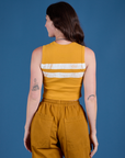 Painted Muscle Tee in Mustard Yellow back view on Alex