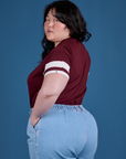 Angled back view of Painted Vintage Tee in Red Wine on Ashley