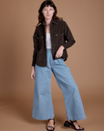 Alex is wearing Cropped Corduroy Overshirt in Espresso Brown and light wash Indigo Wide Leg Trousers