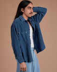 Angled front view of Cropped Corduroy Overshirt in French Blue on Anthony
