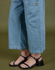 Close up of pant leg of Denim Drop Pocket Pants in Light Wash on Alex