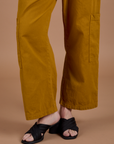 Drop Pocket Cargo Pants in Spicy Mustard pant leg close up on Alex