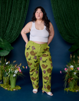 Ashley is wearing Paintstamped Work Pants in Froggy and Cropped Tank in Vintage Tee White