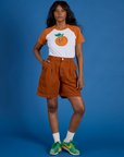 Kandia is wearing Produce Raglan Tee in Orange