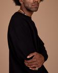 Side view close up of Long Sleeve Burly Tee in Basic Black on Jerrod