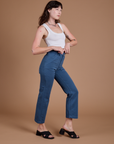 Side view of Organic Work Pants in French Blue and vintage tee white Cropped Tank on Alex