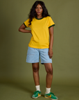 Vintage Ringer Tee in Sunshine Yellow and Carpenter Shorts in Light Wash worn by Kandia