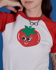 Front close up of Produce Raglan Tee in Tomato on Alex