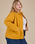 Side view of Denim Work Jacket in Mustard Yellow on Juliet