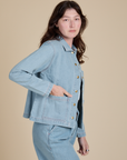 Side view of Indigo Denim Work Jacket in Light Wash on Alex