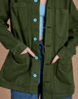 Close up of Ripstop Field Coat in Evergreen on Alex