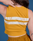 Painted Muscle Tee in Mustard Yellow back close up on Alex