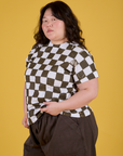 Angled front view of Checker Organic Tee in Espresso Brown on Ashley