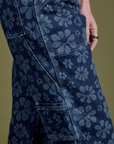 Close up side view of Lazy Daisy Mid-Rise Carpenter Jeans on Alex
