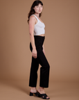 Side view of Organic Work Pants in Basic Black and vintage tee white Cropped Tank on Alex