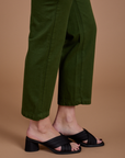 Organic Work Pants in Evergreen pant leg close up on Alex