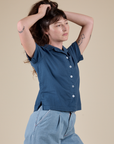 Angled front view of Pantry Button-Up in French Blue on Alex