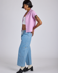 Side view of Pantry Button-Up in Lilac Purple and light wash Denim Drop Pocket Pants on Kira