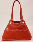 Overall Handbag in Paprika with handles up.