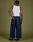 Back view of Denim Drop Pocket Pants in Dark Wash and Cropped Tank in Vintage Tee White on Isaac