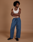 Jerrod is 6’3” and wearing M Drop Pocket Cargo Pants in French Blue paired with a Tank Top in vintage tee white
