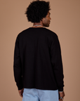 Long Sleeve Burly Tee in Basic Black back view on Jerrod