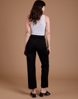 Back view of Organic Work Pants in Basic Black and vintage tee white Cropped Tank on Alex