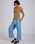 Angled front view of Jr. Varsity Tee in Desert Brown and light wash Denim Drop Pocket Pants