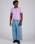 Jr. Varsity Tee in Lilac Purple and light wash Denim Drop Pocket Pants on Isaac