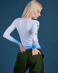 Floral Long Sleeve Baby Tee in Baby Blue back view on Madeline