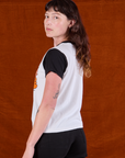 Anniversary Tee in Smile angled back view on Alex