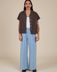 Anthony is wearing Pantry Button-Up in Espresso Brown and light wash Indigo Wide Leg Trousers