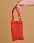Cell Phone Tote in Mustang Red held by model