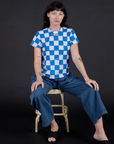 Alex is wearing Checker Organic Tee in Blue and Drop Pocket Cargo Pants in French Blue