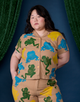 Ashley is wearing a buttoned up Paintstamped Pantry Button-Up in Froggy