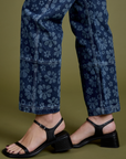Pant leg side view close up of Lazy Daisy Mid-Rise Carpenter Jeans on Alex