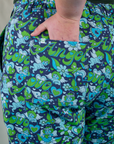 Close up of Juliet's hand in the back pocket of Work Pants in Angel Print