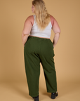Baggy Mid-Rise Trousers in Evergreen back view on Juliet