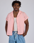 Isaac is 5’10” and wearing M Pantry Button-Up in Baby Pink