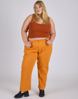 Juliet is 5’7” and wearing 2XL Work Pants in Creamsicle Orange paired with burnt terrracotta Cropped Tank