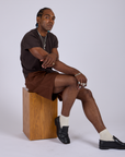 Pleated Trouser Shorts in Fudgesicle Brown and espresso Organic Vintage Tee worn by Jerrod