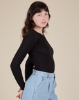 Long Sleeve Baby Tee in Basic Black side view on Alex