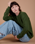 Side view of Long Sleeve Burly Tee in Evergreen on Alex