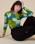 Long Sleeve Baby Tee in Green Magic Waters and black Drop Pocket Cargo Pants on Alex