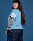 Painted Burly Tee in Baby Blue angled back view on Sydney