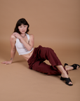 Drop Pocket Cargo Pants in Red Wine and vintage tee white Cropped Tank worn by Alex