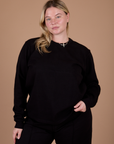 Lish is 5’8” and wearing S Long Sleeve Burly Tee in Basic Black